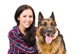 Portrait of a smiling beautiful young woman and German Shepherd